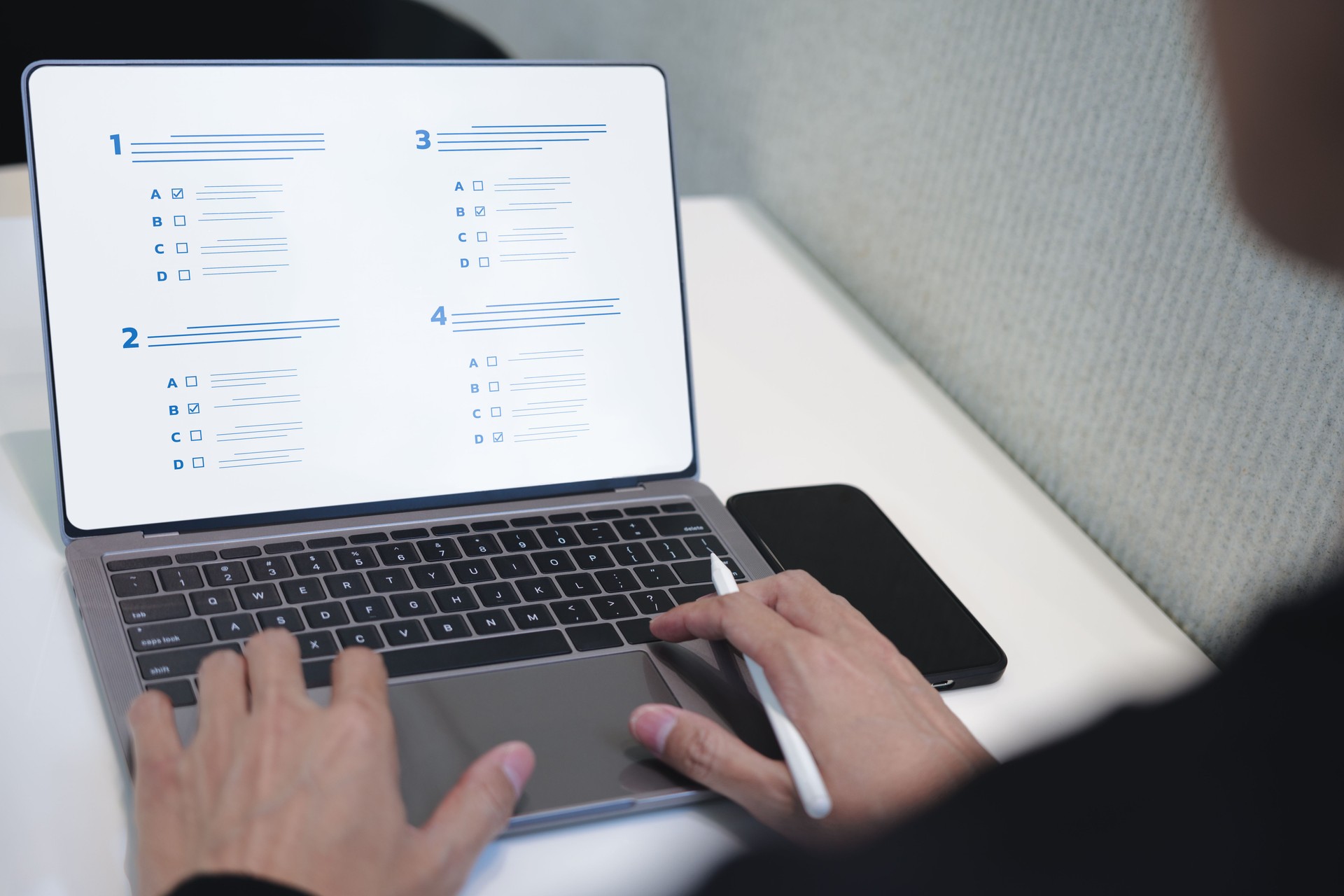 Businessman evaluating with checkbox on online laptop. assessment survey online, choose correct answer in test, questions test, online exam, quiz knowledge, filling out a survey form. Checklist online